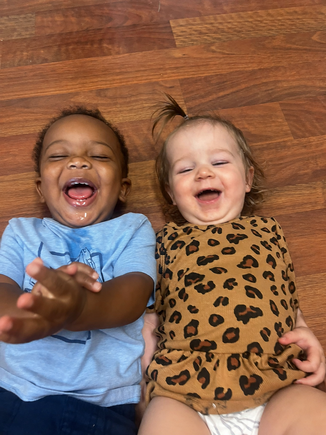 Two smiling toddlers